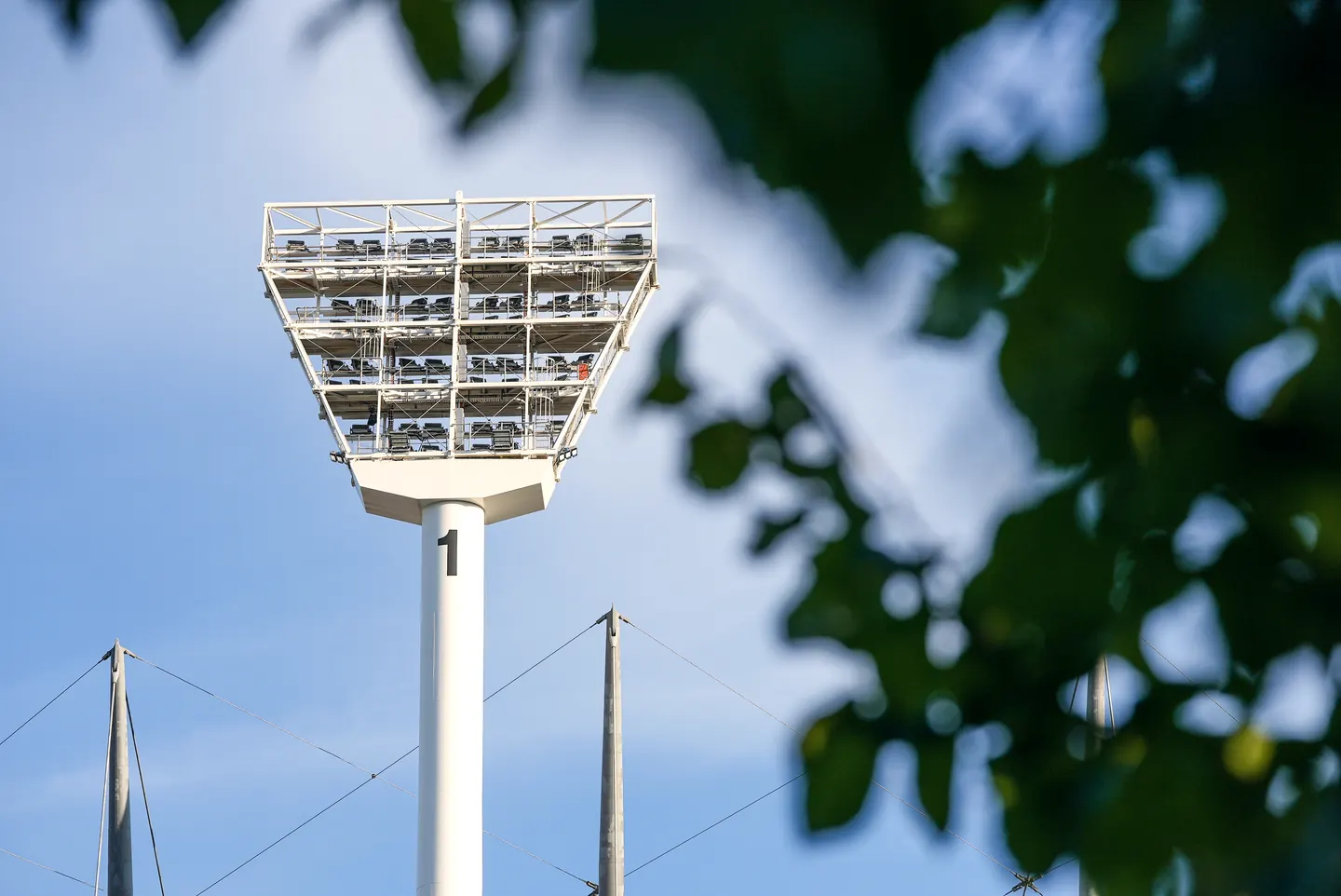 Stadium floodlight tower at dusk